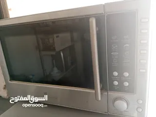  9 ميكرويف مع فرن حجم كبير/شغال 100/100لون سلفر للبيع المستعجل