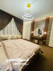  3 Two rooms and a hall for monthly rent in Ajman, overlooking the creek, new furnishings, Al Rashidiya