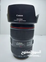  7 للبيع عدسة 105-24 canon الأصدار الثاني الخط الأحمر، نظيفة جدا+ هود للعدسة مجانا