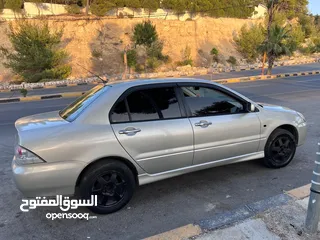  4 ميتسوبيشي لانسر 2006 وارد لكويت للبيع كاش