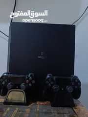  7 ps4 pro ssd 1 T يدات اثنين و اربع اقراص و ستاند شحن جوستك وتبريد وحامل اقراص