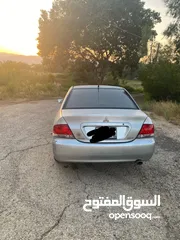  5 متسوبيشي لانسر 2009وارد لكويت بحاجة لدهان فقط