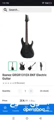  4 Ibanez electric guitar with amplifier
