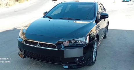  10 متسوبيشي لانسر فراشة موديل 2015 فحص مرفق مع الصور بحالة الوكاااااالة  ماشية 49 الف km  أصلي