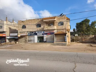 22 عمارة تجارية و سكنية  في جرش للبيع العمارة على شارعين    شارع رئيسي و شارع فرعي في منطقة حيوية