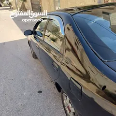  1 كيا شوما 1999