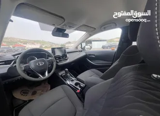  20 تيوتا كورولا هايبرد ترخيص 2022 فل بدون فتحة مميزة  ماتور 1800cc ( بنزين + كهرباء) 170Hp