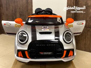  1 سيارة أطفال 3 ماتورات بتصميم سيارة Mini Cooper للشارع والبيت من سنتين ل 5سنوات