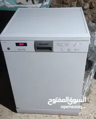  1 جلاية يابانية ماركة شارب مرشين + رفين بحالة ممتازة و شغالة 100%