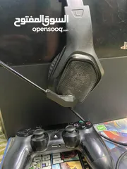  1 ps 4 with controller and gaming headphones in good condition
