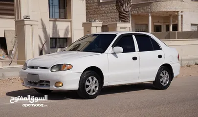  12 هونداي اكسنت هاتشباغ موديل 1998 لون ابيض   بسعر مغري و مميز جدددددا