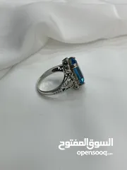 18 *خاتم فضة بحجر أكوامارين – عيار 925، وزن 5.4 جرام