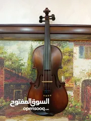  2 كمان ساندنر (Sandner) بحالة ممتازة مع جميع مستلزماته.