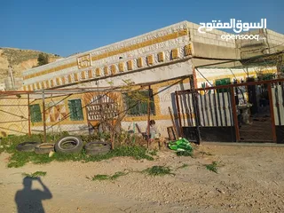  1 بيت للبيع عليه أرض دونمين مشجرات من كل شيء كاش 27 او دفعه 15 قسط شهري 150