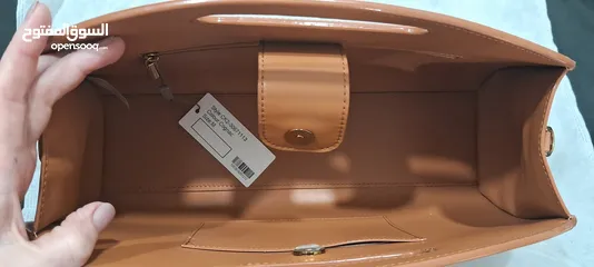  10 tags on new camel handbag unique with detachable strap