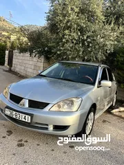  11 لانسر وقابل للبدل ع مرسيدس E200 حديث او X5bmw