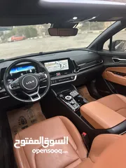  13 كيا سبورتاج هايبرد 2023 - فل كامل مع بانوراما - غرفة مميزه - عداد قليل اصلي - إمكانية التقسيط.