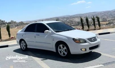  1 كيا سيراتو 2008 ماتور 1600 بنزين اوتومات عدد 2 لون ابيض ولون اسود