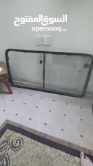  5 زجاج باص بريجو الباب سحاب للبيع وغال باب ويد باب ومنفاخ الجمل وبعض قطع باص بريجو كيا