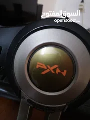  2 a pxn simulator pack with a steering wheel and a pedals with a gear shifter
