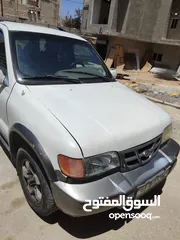  5 كيا سبورتاج موديل 2000 لون ابيض ماتور 2000 توماتيك