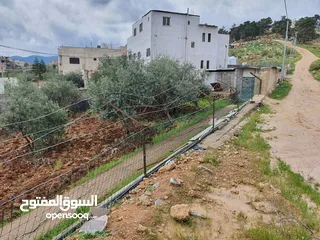  14 عمارة تجارية و سكنية  في جرش للبيع العمارة على شارعين    شارع رئيسي و شارع فرعي في منطقة حيوية
