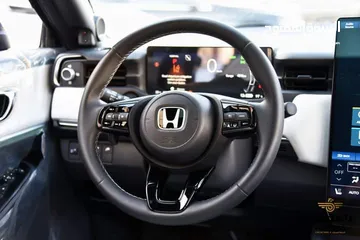  15 هوندا Honda E-NP1 لون اسود موديل 2023