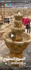  1 نوافير حديقه كبيره ملبسه حجر