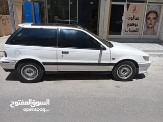  2 متسوبيشي ميراج 1990 ابيض باب واحد