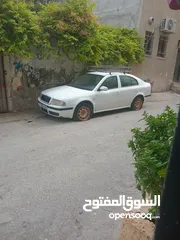  4 سكوده اكتافيه موديل 2002 ديزل جير عادي اصل عمومي لون ابيض مطور 1900 جير ومطور شغلات ميه ميه