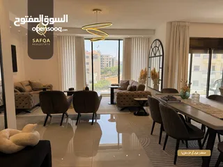  1 شقة مميزة جداً واسعة بتشطيب حديث للبيع في عين منجد في عمارة عصرية راقية
