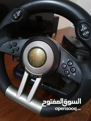  1 a pxn simulator pack with a steering wheel and a pedals with a gear shifter
