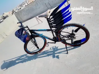  20 بيع بسكليت بحاله جيده جدااا اللون اسود وازرق واضح بالصوره غيارات شغاله وبرك شغال 100%