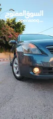  3 نيسان التيما هايبرد 2009 فل كامل مسكر اعلى صنف لون فيراني