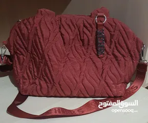  9 حقيبة سكتشرز لون قرميدي