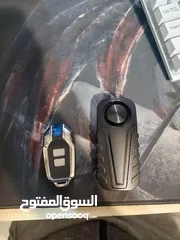  1 جهاز إنذار للدراجات وصندوق شاحن السيارات الكهربائيه
