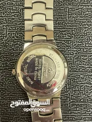  4 espec ساعة فضية كوارتز ستانلس ستيل ضد الماء صنع في الصين سير على شكل صدفات بحرية الداخل أسود