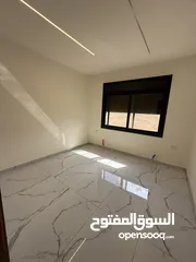  18 شقه طابق ارضي 144متر مع ترس 30 متر للبيع في جبيهه حي المنصور بموقع مميز