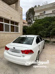  2 كيا اوبتما لوتسي 2009 لون ابيض بحالة جيدة جدا