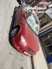  7 مازدا 323 موديل ال2003 باعتبار فحص كامل