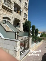  8 للبيع شقة ارضية شبه جديدة مع تراس وكراج في اجمل مناطق عمان خلدا موقع مميز السعر مغري جدا