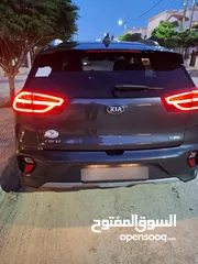  17 سياره كيا نيرو 2021 لون فيراني كامل الإضافات ما عدا الفتحه للبيع فحص 7 جيد