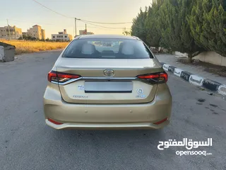  16 تويوتا كورولا 2021 لون شمباني بنزين اصلي ماتور cc1600 فحص كامل جمرك حديث