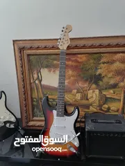  1 Fender electric guitar stratocaster replica with 10 watt amplifier.
