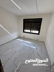  19 شقه طابق ارضي 144متر مع ترس 30 متر للبيع في جبيهه حي المنصور بموقع مميز