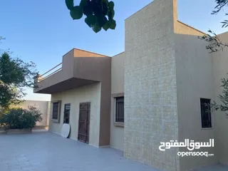  1 قطعة ارض بها منزلين 4000 متر طريق المطار طرابلس