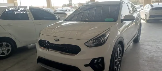  4 كيا نيرو 2021 جمرك جديد وارد كوري ممشي 32  الف فحص كامل جنطات تورنج