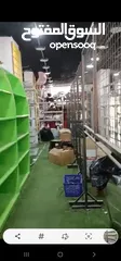  16 رفوف خشب وزجاج وسوبرماركت وقرمه ولوحة اعلانات و معرش زينكو وأبواب سيكريت مظله وألواح خشب تعليق وشبك