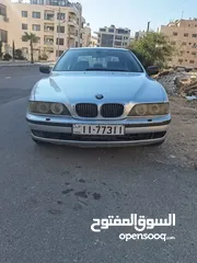  1 BMW 520 - 4 جيد مع فحص شامل + نمرة رقم مميزة، السيارة full مع فتحة بالسقف- إلا قماش مش  جلد