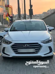  1 هونداي افانتي AD بحالة الوكالة موديل 2018  لون ابيض فحص كامل مالك اول من المنطقه الحرة/ كراسي جلد